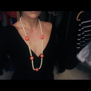 Pearl necklace with coral colored accents